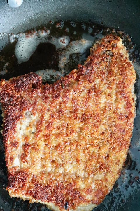 Fried Italian breaded pork chop.