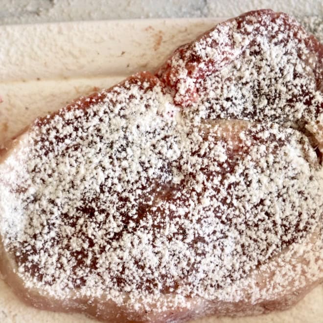Flour dredge pork chop.