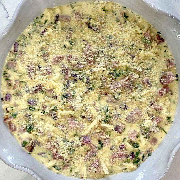 Mixed ingredients in pie dish ready to bake.
