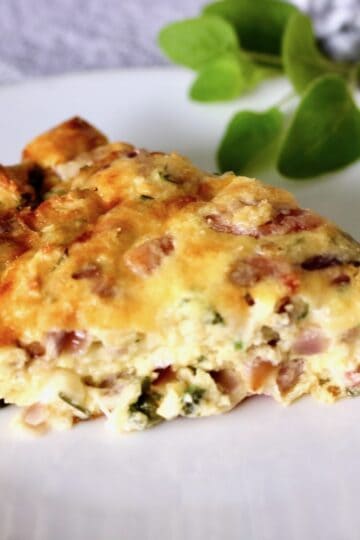 Sliced quiche on a plate.