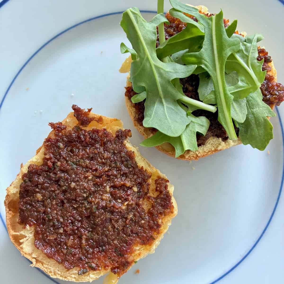 Toppings on a bun for smash burger recipe.