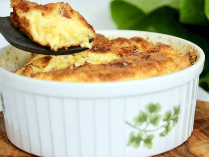 A spoon of cheese soufflé with prosciutto..