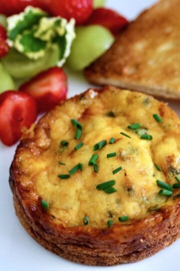 Frittata with a side of fruit and toast.