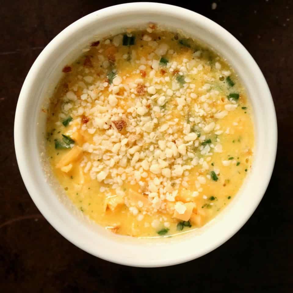 Sprinkle of cheese and herbs on frittata.