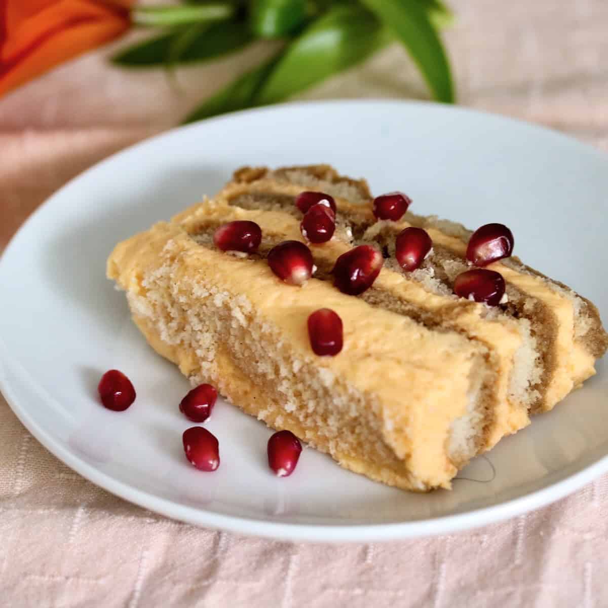 Pumpkin spice tiramisu garnished with pomegranate seeds.