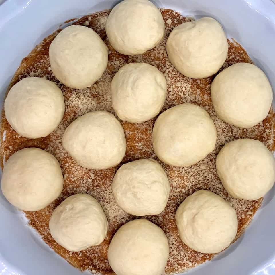 Freshly made dough balls cinnamon panko bread crumbs ready to bake or chill.