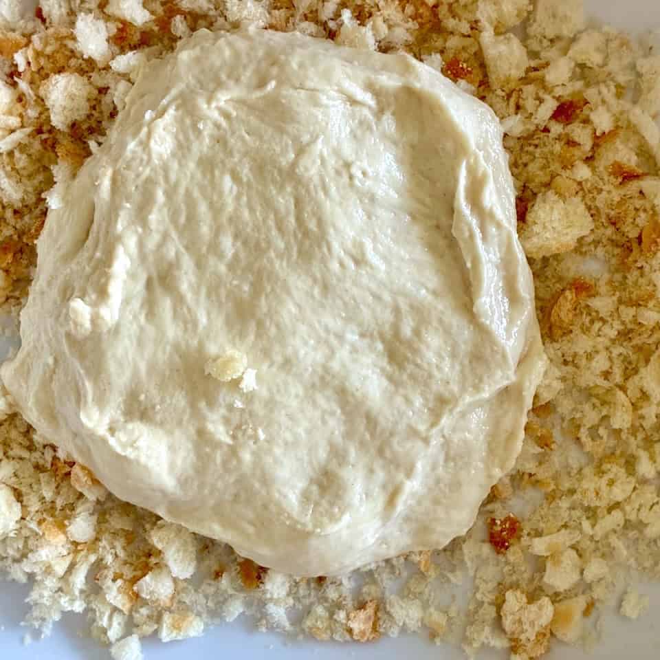 Stretched dough in breadcrumbs.