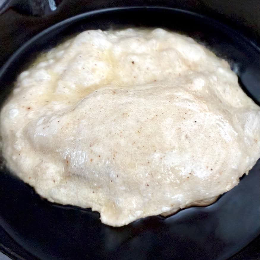 Frying bread.