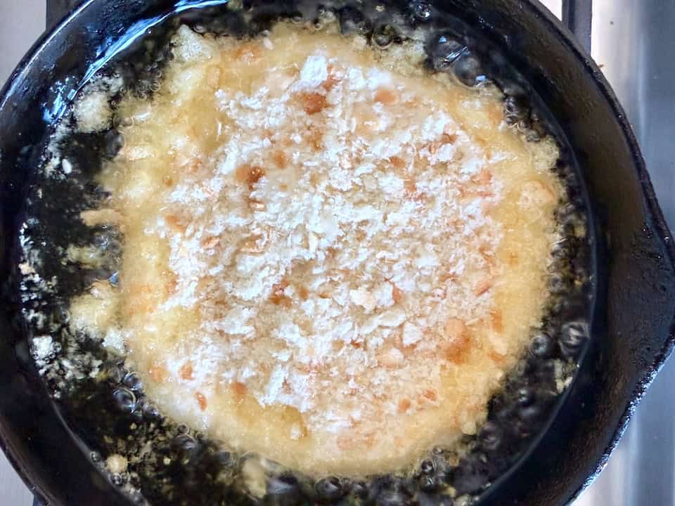 Frying crusty bread.