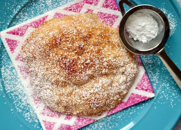 Fried dough with powdered sugar.