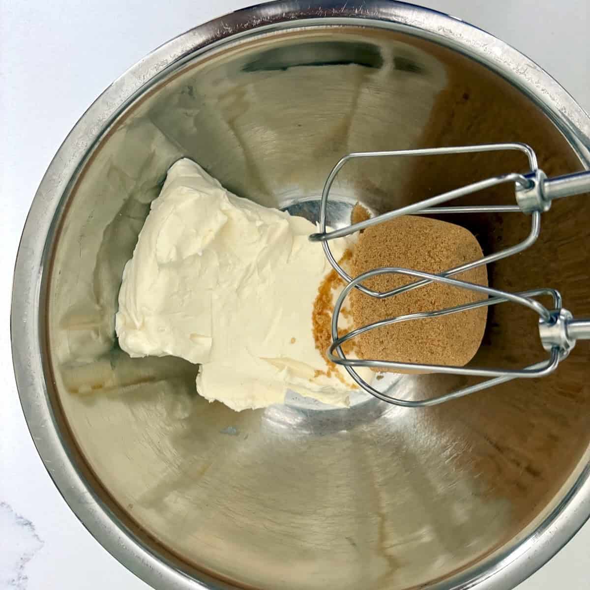 Mixing cream cheese and brown sugar.