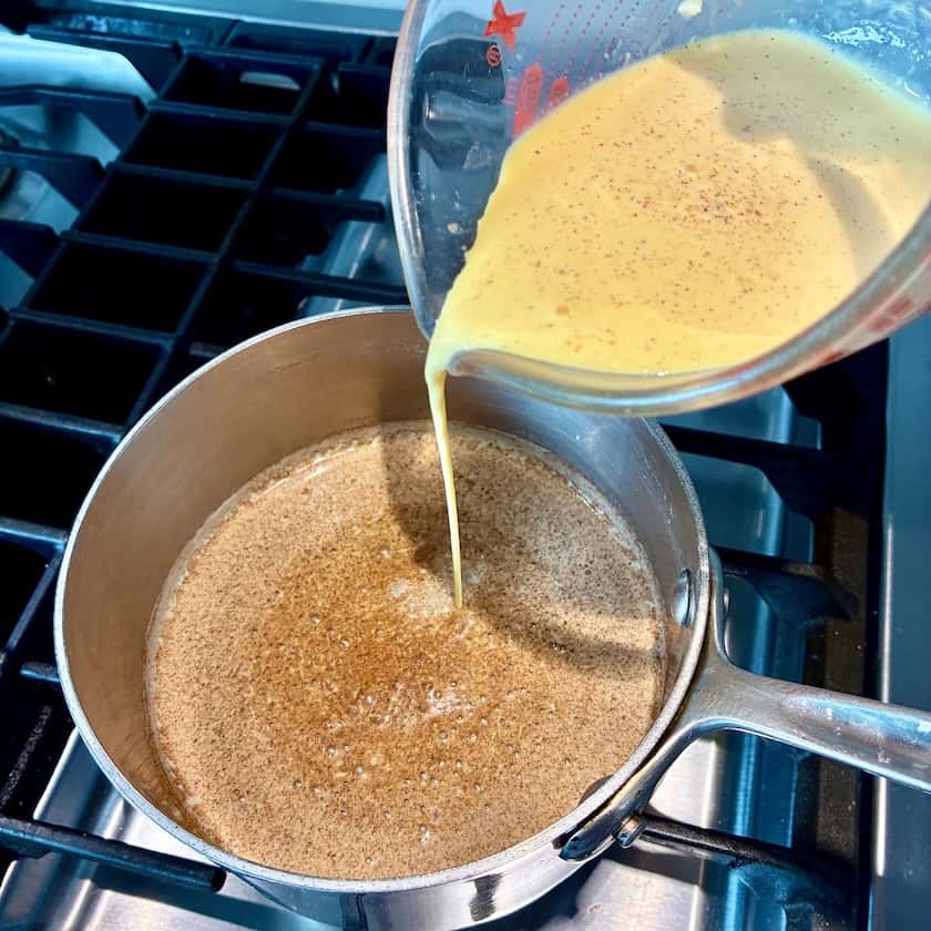 Cooking custard ingredients on the stove.